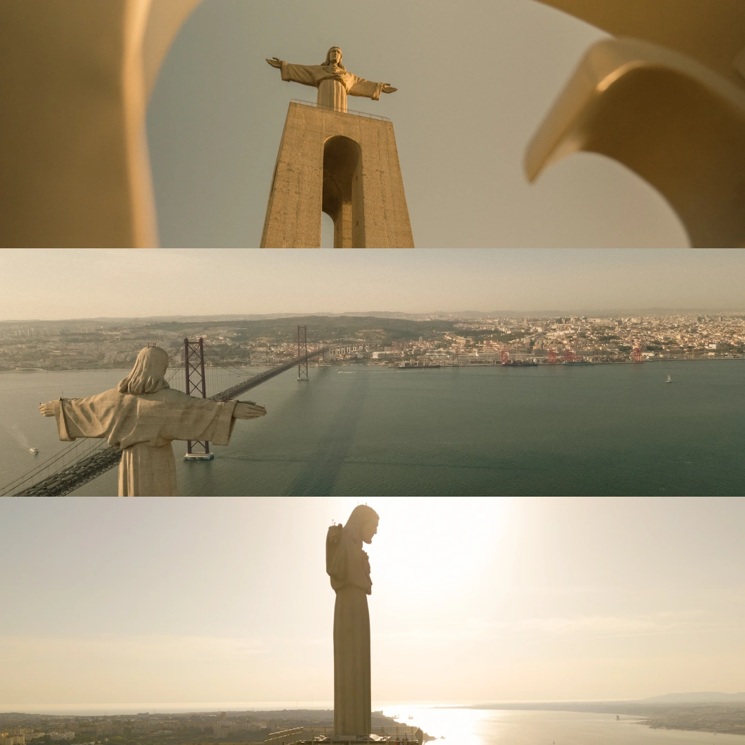 Cristo Rei statue in Almada, Portugal, viewed from across the 25 de Abril Bridge